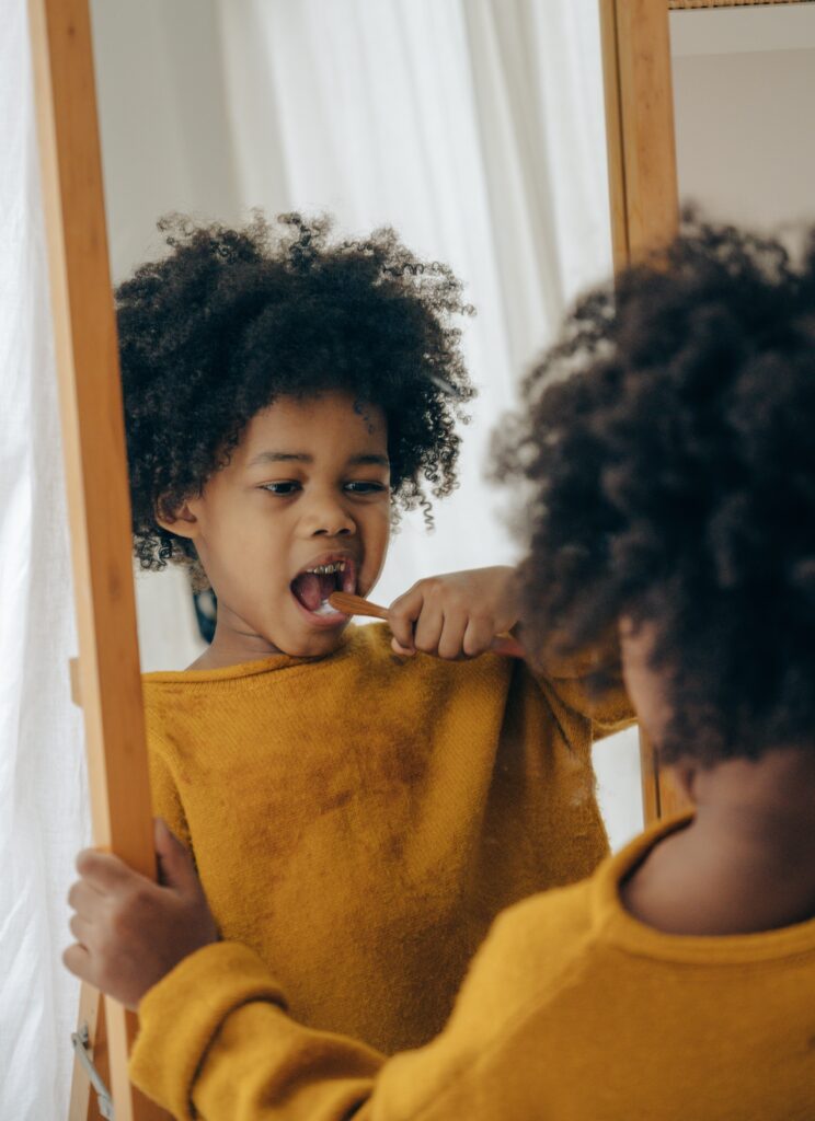 A child brushing their teeth